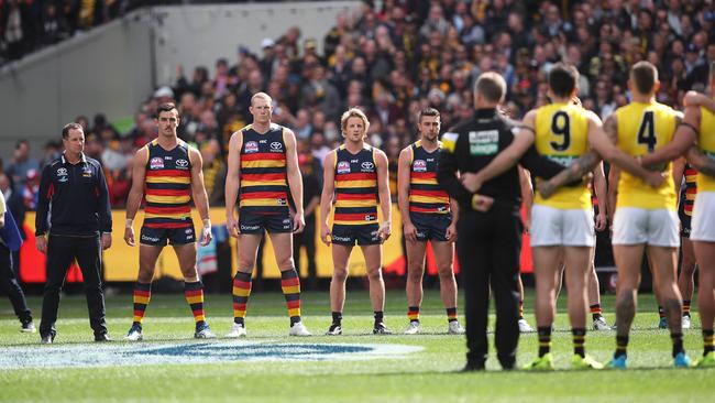 The Crows stare during the anthem before the AFL grand final in 2017