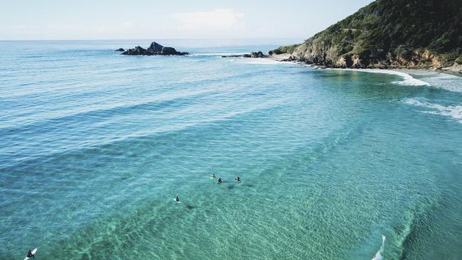 Surfers at Broken Head Beach, south of Byron Bay. Picture: Destination NSW