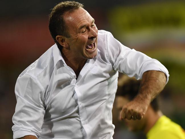 Raiders coach Ricky Stuart celebrates a try by his team during the Round 4 NRL match between the Canberra Raiders and the Canterbury-Bankstown Bulldogs at GIO Stadium in Canberra, Thursday, April 5, 2018. (AAP Image/Lukas Coch) NO ARCHIVING, EDITORIAL USE ONLY