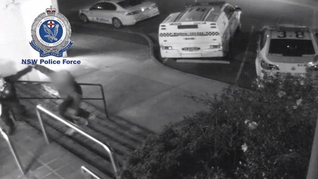 The male officer is able to deflect the man before trying to grab him. Picture: NSW Police