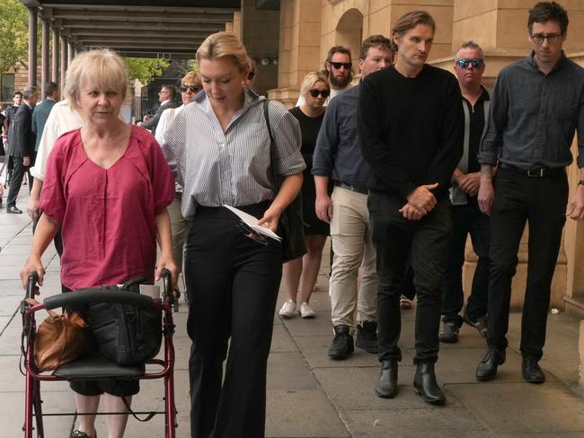 The Sweetman family leave court accompanied by dozens of supporters. Picture: Dean Martin