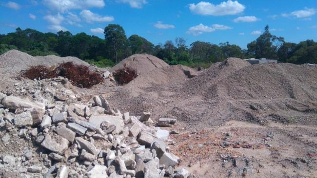 Photo of the existing landscaping and building material storage area.