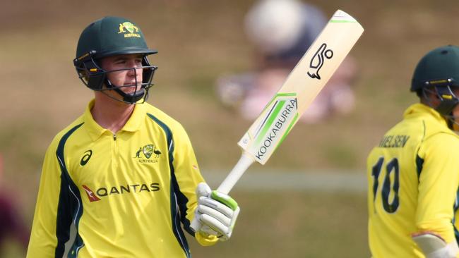 Australia's Mackenzie Harvey raises his bat after scoring 50 for Cricket Australia XI. (AAP Image/David Moir)