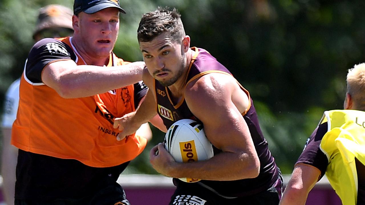 Corey Oates takes on the defence during a Brisbane training session.