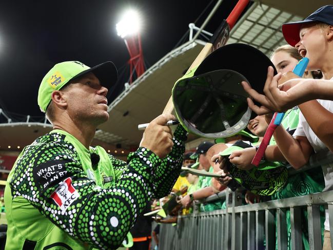 SYDNEY, AUSTRALIA - JANUARY 13:  David Warner of the Thunder interacts with fans after the Men's Big Bash League match between the Sydney Thunder and the Perth Scorchers at Sydney Showground Stadium, on January 13, 2023, in Sydney, Australia. (Photo by Matt King/Getty Images)