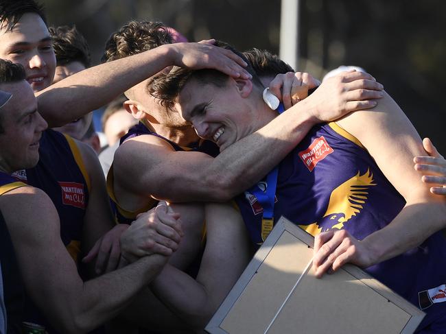 Andrew Ainger is congratulated by team mates after winning the EFL Div 1 Grand final best on ground award between Vermont and South Croydon in Bayswater, Saturday, Sept. 22, 2018. Picture:Andy Brownbill