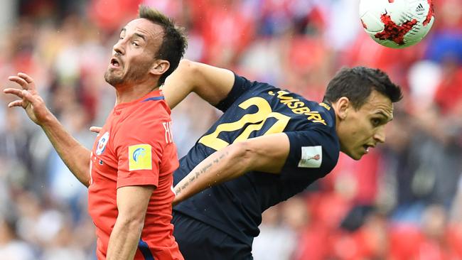 Chile's Jose Fuenzalida flies against Trent Sainsbury during the 2017 Confederations Cup.