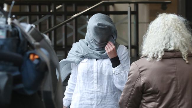 Ms Garth covered her face and declined to speak. Picture: NewsWire / David Crosling