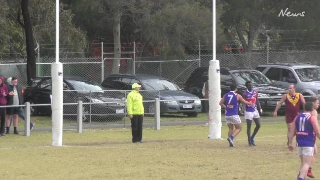 Murrumbeena Football Club champion Luke James kicks a spectacular goal