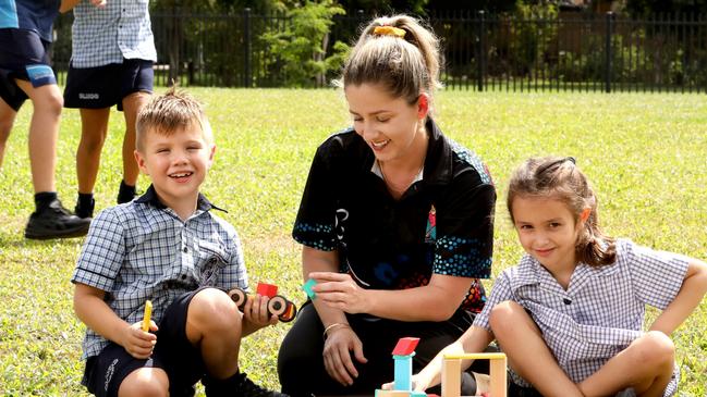 Our Lady Help of Christians OSHC co-ordinator Alexis Curtis with students Oliver Hislop and Ruby Bita. Photo: Anna Rogers