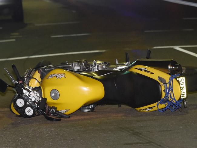 EXCLUSIVE PICS OF RIDER: A 25yo man has crashed his motorcycle after taking off from Police in Coogee at around midnight last night . The man had been stopped by police not far away for questioning when he has suddenly driven off from Police at high speed up Coogee Bay Rd. The man has come off his bike and hit his head heavily on a white sedan parked in Coogee Bay Rd, meanwhile his bike has continued around 100 metres up the road before coming to an abrupt stop. The bike left a long trail of petrol after the man hit the white car. NSW Fire Brigade were called to clean up the long spill. The rider was only wearing shorts and singlet at the time of the crash and subsequently received nasty grazes as a result of the crash. The man was thought to have been highly intoxicated. Police are expected to charge the man on his release from hospital. Picture: Gordon McComiskie