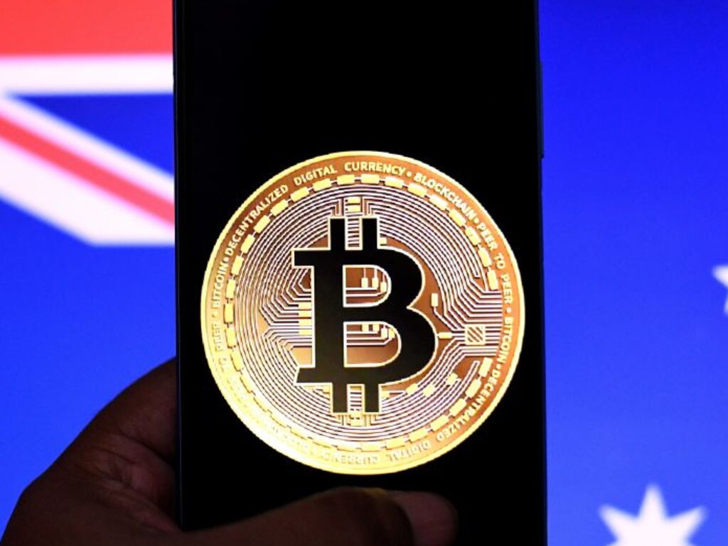 INDIA - 2021/11/30: In this photo illustration, a Bitcoin logo seen displayed on a smartphone with an Australian flag in background. (Photo Illustration by Avishek Das/SOPA Images/LightRocket via Getty Images)