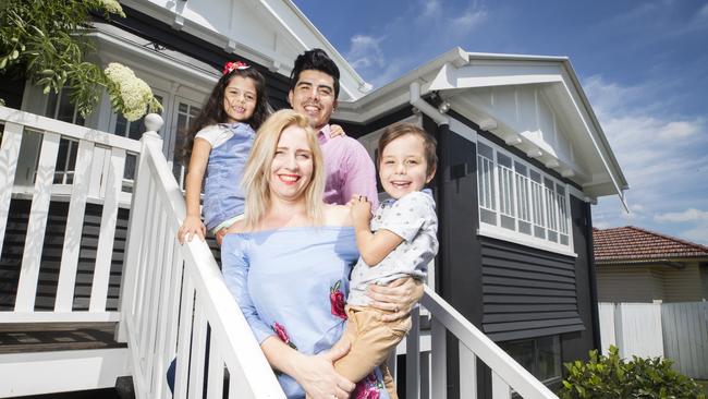 Krystal and Josue Lopez outside their Camp Hill Home with children Jemima 6 and Ezekiel 5. Picture: Lachie Millard.