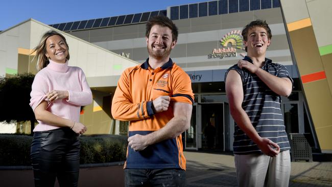 Georgie Todd, 36, tradie Rhys Kalic, 27, and Pulteney Grammar year 12 student Matthew Button, 18, will all will be eligible for the Pfizer vaccine as of Monday. Picture: Naomi Jellicoe