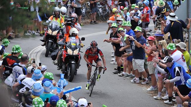 Cadel Evans grimaces as he climbs a hill on his way to winning Stage Three, becoming TDU leader.