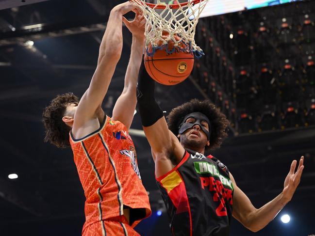 Taran Armstrong of the Taipans is blocked by Keanu Pinder of the Wildcats. Picture: Matt Roberts/Getty Images for NBL