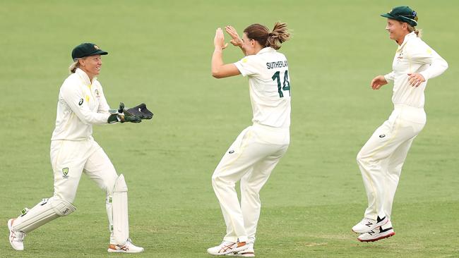 Alyssa Healy, Annabel Sutherland and Meg Lanning celebrate an English wicket in Canberra. Picture: Mark Kolbe/Getty Images