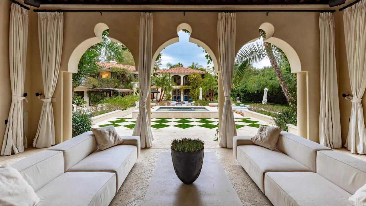 The Mediterranean-style mansion boasts a stunning backyard and pool area. Picture: Realtor