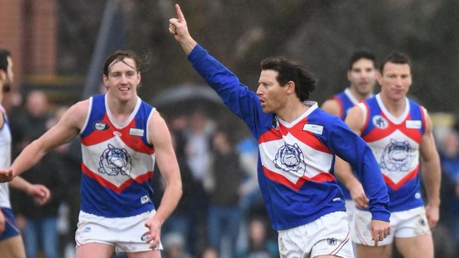 Shane Harvey celebrates a goal for North Heidelberg. Picture: Nathan McNeill