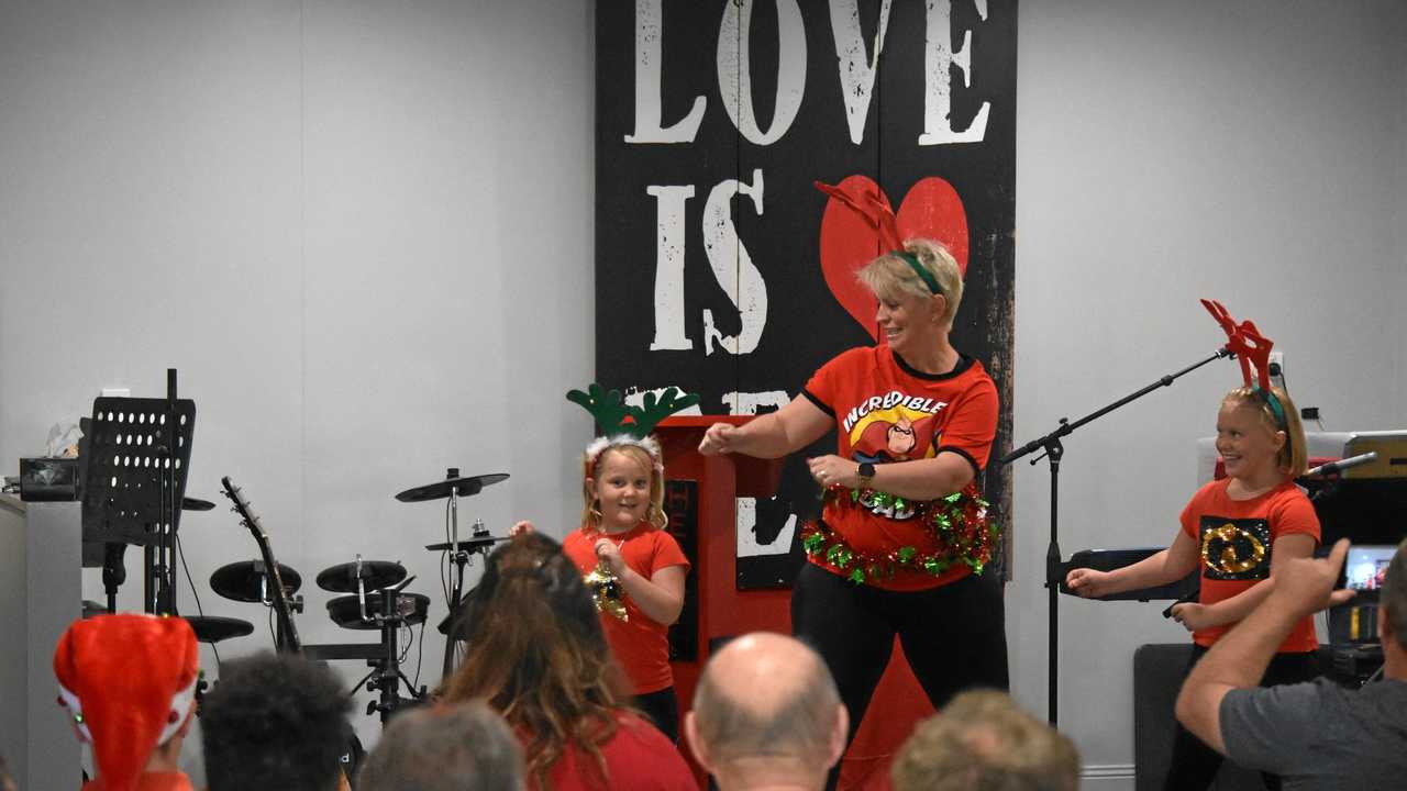 FEELING GROOVY: Senior Pastor Heidi Westbrook dances with her daughters Emmalee and Sophia. Picture: James Liveris