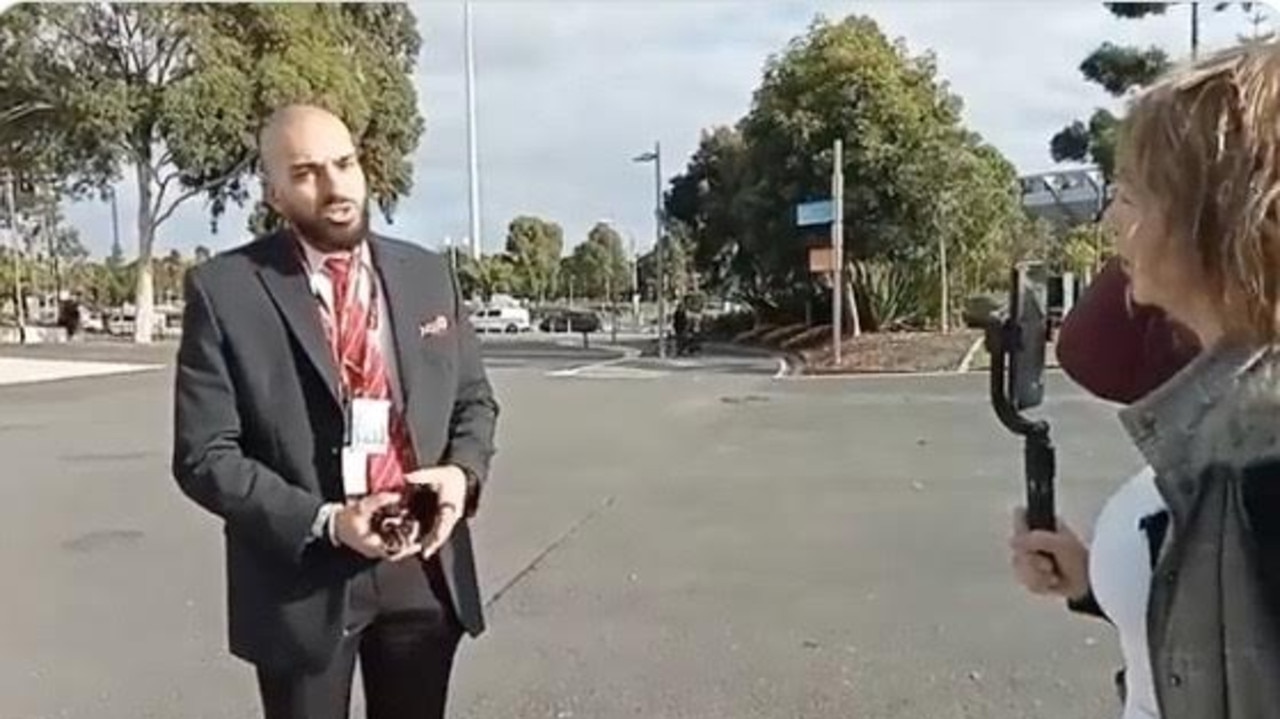 A security guard takes on a group of protesters outside a Barack Obama speaking event. Picture: Twitter