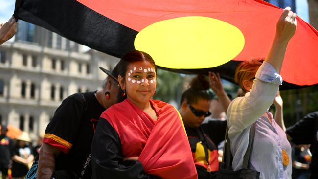 Protesters take part in an Invasion Day rally and march in Brisbane, coinciding with Australia Day. Picture: NCA Newswire / Dan Peled