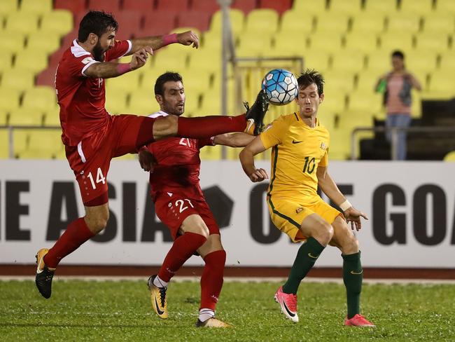 Tamer Hag Mohamad gives a studs up to Robbie Kruse.