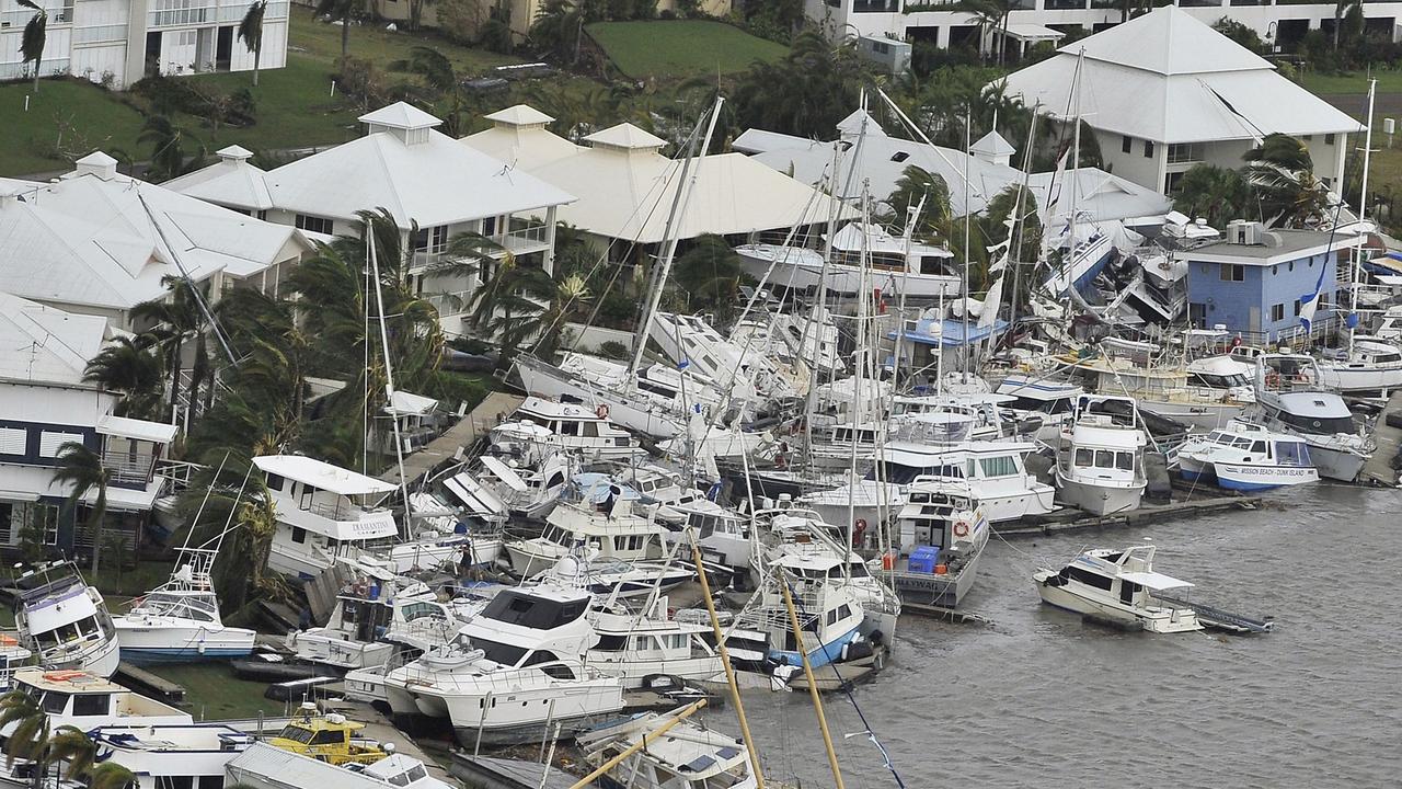 Luxury boats at the Hinchinbrook Marina after Cyclone Yasi barrelled through in 2011 AFP PHOTO / Paul CROCK Pic. AFP