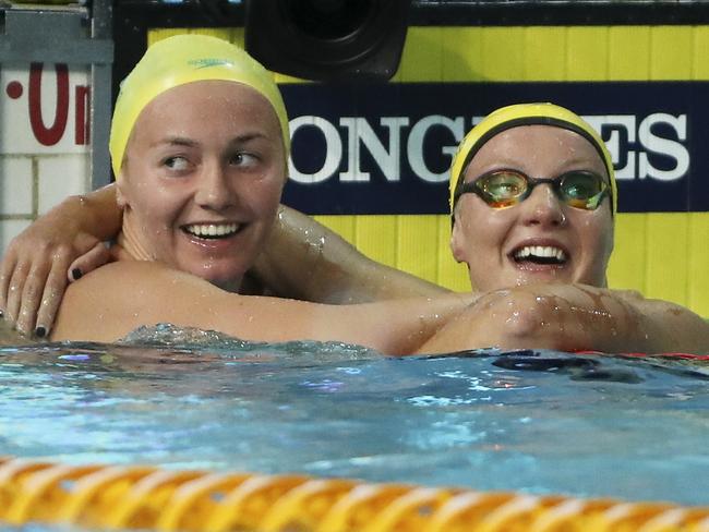 Ariarne Titmus (left) celebrates after winning gold in the 800m. Picture: AP