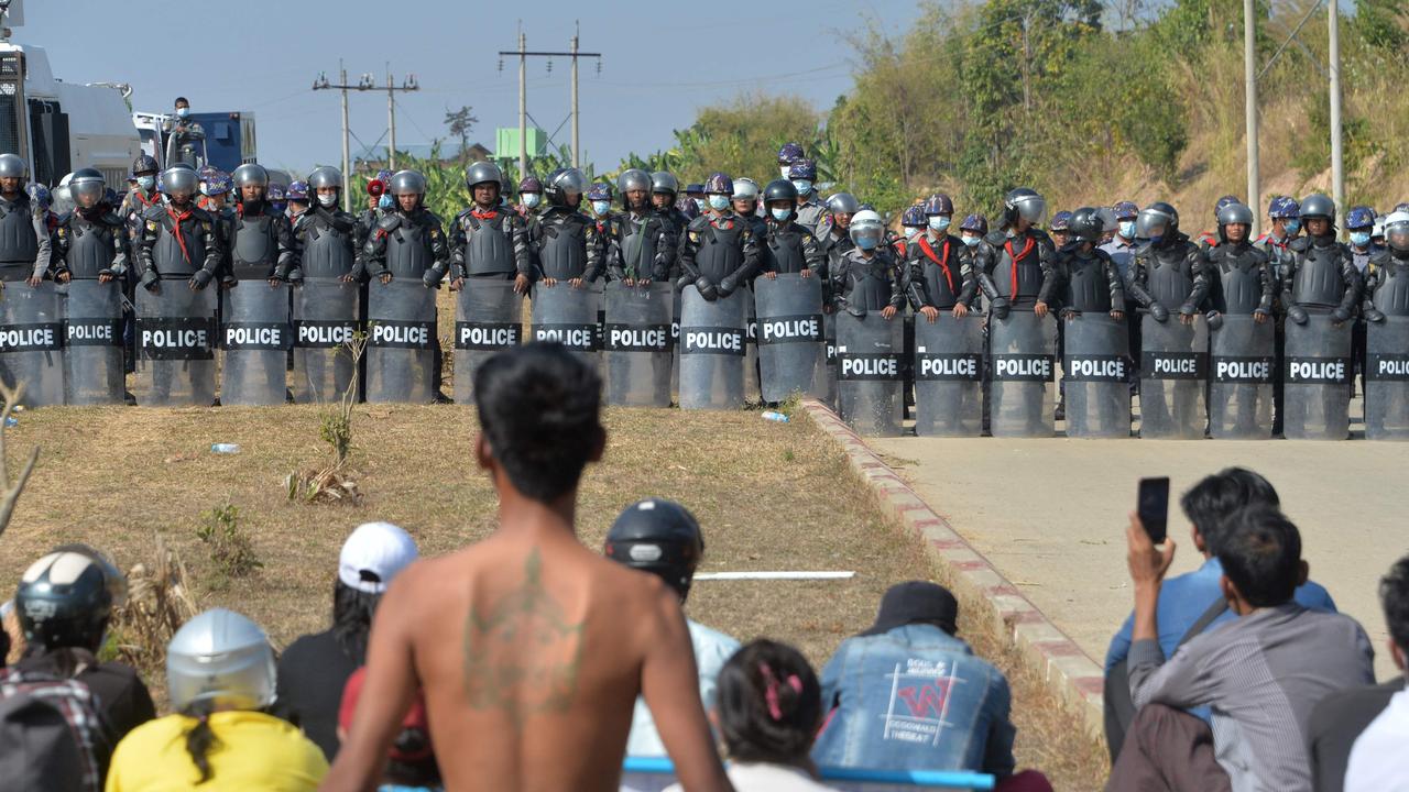 Riot police stand guard near a prison during a demonstration by protesters against the military coup in Naypyidaw on February 15. Picture: STR/AFP