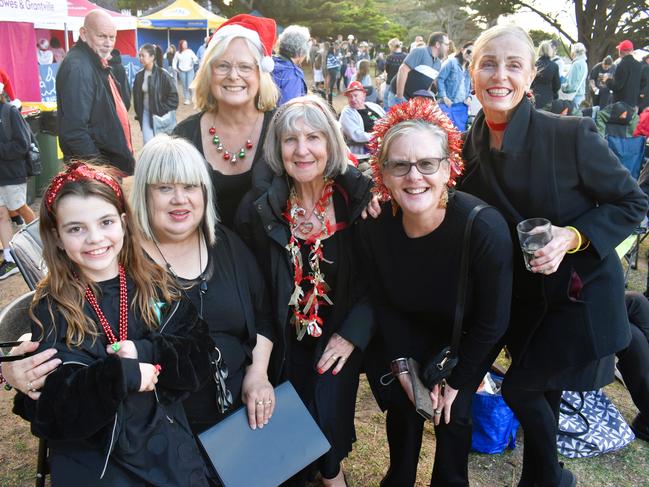 Paige, Irene Bennetts, Maria Kirwan, Bev Watson, Susan Hulme, Helen Murray and Mary Taylor getting festive at the Phillip Island Christmas Carols by the Bay at the Cowes Foreshore on Tuesday, December 10, 2024. Picture: Jack Colantuono