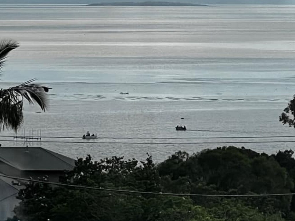 Two boats reach the bull.