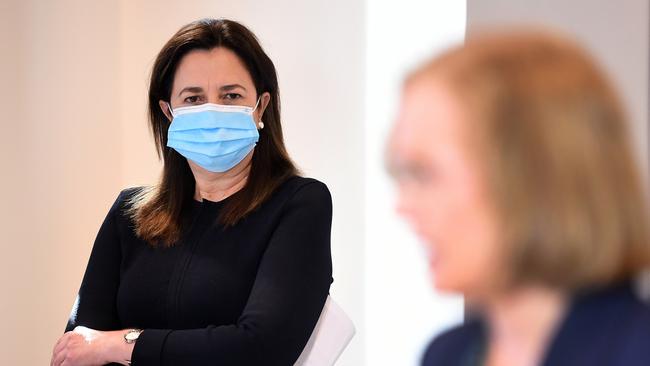 Queensland Premier Annastacia Palaszczuk watches her chief health officer Dr Jeannette Young during a Covid update. Picture: Dan Peled