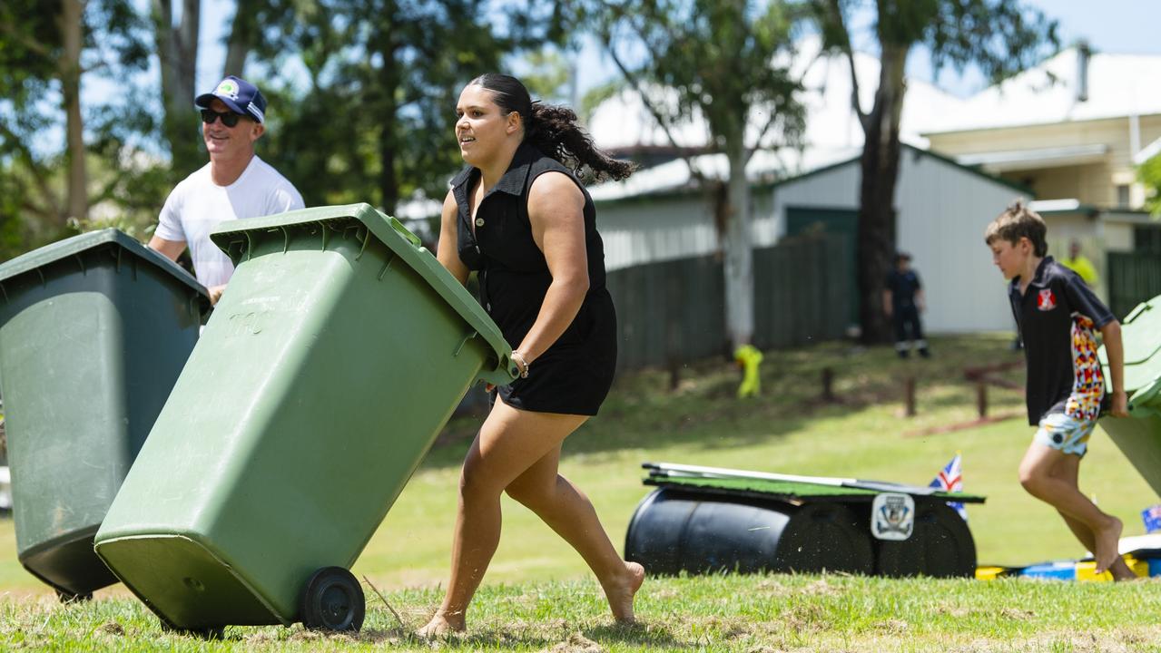 Nev Cherry and Poppie Collins compete during a heat of the wheelie bin races at Oakey Australia Day celebrations in Arthur Shooter Park, Thursday, January 26, 2023. Picture: Kevin Farmer