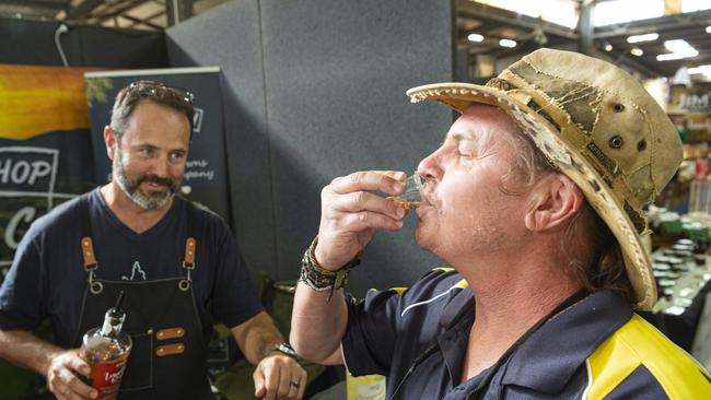 Brad Smith (right) tastes a gin called ImaGin Rose from Matt Service of Gowrie based Hop Scotch Distillers at the Toowoomba Royal Show, Thursday, April 18, 2024. Picture: Kevin Farmer