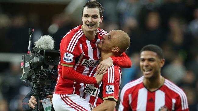 Adam Johnson is held aloft after his 90th-minute winner.