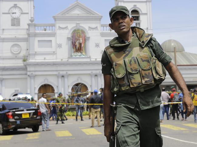 Sri Lankan Army soldiers secure the area after a blast in Colombo, Sri Lanka, Sunday. More than two hundred people were killed and hundreds more injured. Picture: AP Photo