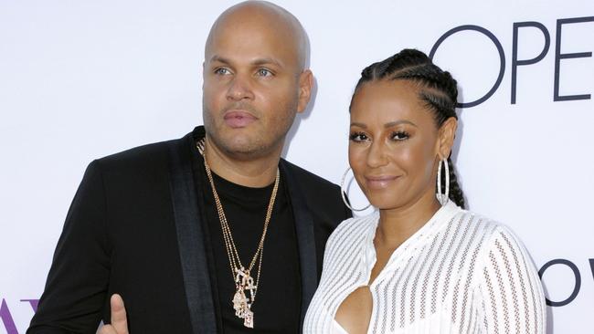 Stephen Belafonte, left, and Mel B on the red carpet. She claims she would cover up for him as the abuse continued. Picture: Richard Shotwell/Invision/AP, File)