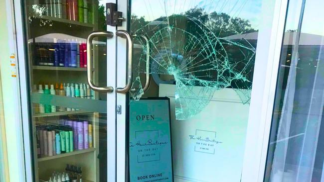 The smashed plate-glass window at The HairBoutique at Victoria Point. Picture: Judith Kerr