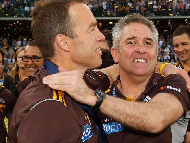 Alastair Clarkson, Senior Coach of the Hawks (left) and Chris Fagan celebrate during the 2014 Toyota AFL Grand Final match between the Sydney Swans and the Hawthorn Hawks at the MCG, Melbourne on September 27, 2014. (Photo: Michael Willson/AFL Media)