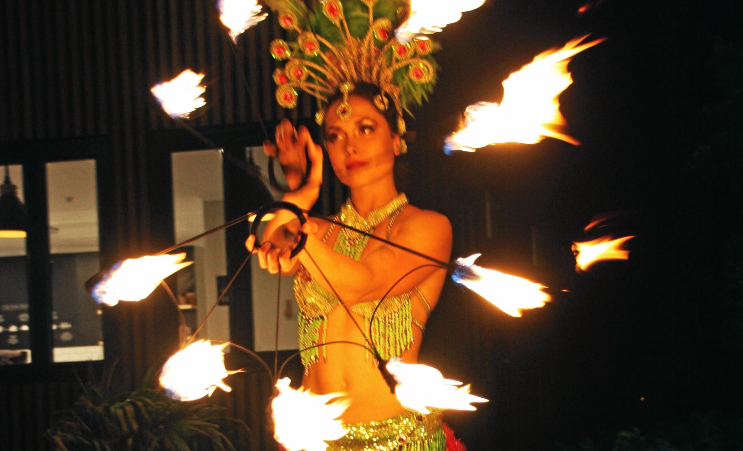 Fire dancer Sasha at AVID Property Group's launch of its new sales and information centre in Palmview's master-planned community of Harmony. Picture: Erle Levey