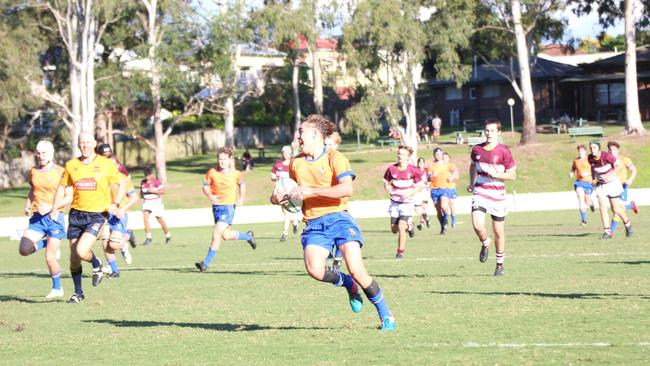 Nate Roberts on his way to scoring at Ashgrove.