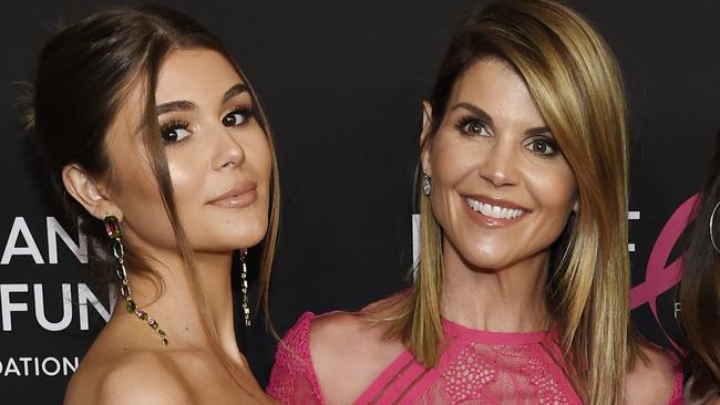 Actor Lori Loughlin, right, was charged with fraud and conspiracy in the sting involving daughter, Olivia Jade Giannulli. Picture: Invision/AP