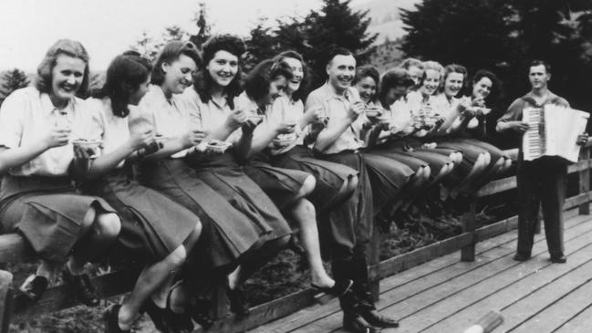 A group eat blueberries and enjoy listening accordion music. Picture: United States Holocaust Memorial Museum