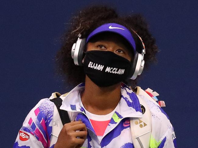 Naomi Osaka walks out for her US Open second-round match last year with a face mask bearing the name of Elijah McClain, a Black victim of alleged police violence. Picture: Matthew Stockman/Getty Images