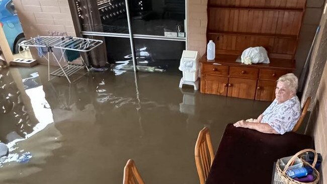 Dianna Quick, 78, sits at her house as she waits for someone to rescue her.