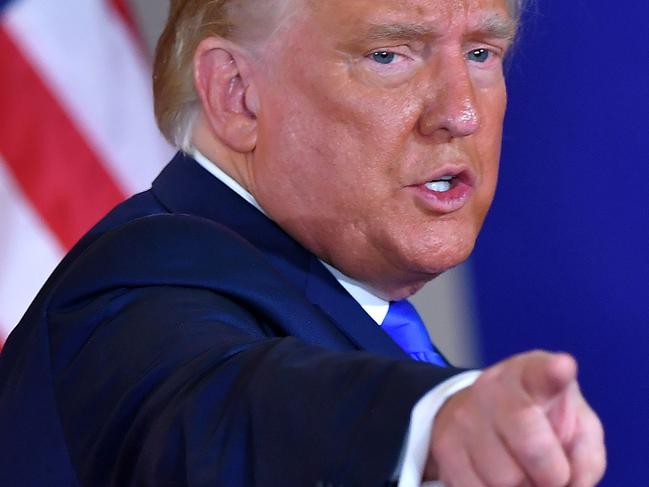 (FILES) In this file photo taken on November 04, 2020 US President Donald Trump gestures after speaking during election night in the East Room of the White House in Washington, DC. - US President Donald Trump has confirmed he will address a rally of his supporters January 6, 2021 in Washington, called in protest at the certification by Congress of the 2020 election results. "I will be speaking at the SAVE AMERICA RALLY tomorrow on the Ellipse at 11AM Eastern (1600 GMT)," tweeted the Republican, who refuses to concede defeat to President-elect Joe Biden. (Photo by MANDEL NGAN / AFP)