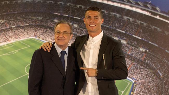 Cristiano Ronaldo of Real Madrid embraces club President Florentino Perez.