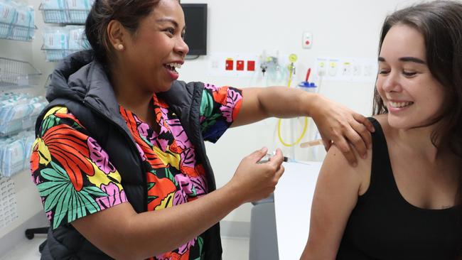 Nurse Lea Scheltens delivers a whooping cough vaccination.