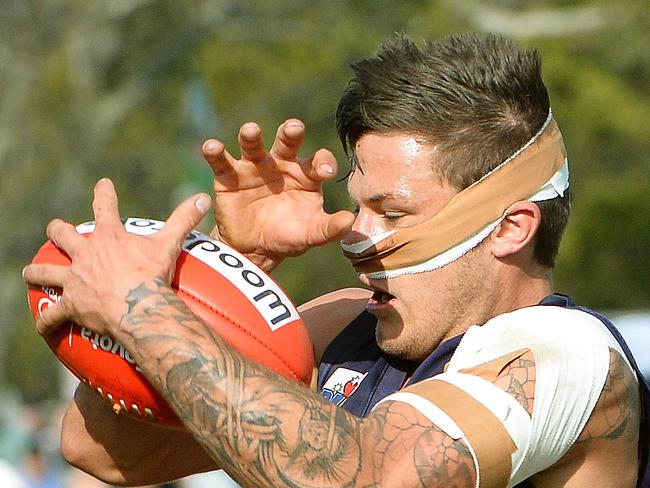 A mummified Brandon Kilty attacks the ball. Picture: Carmelo Bazzano.